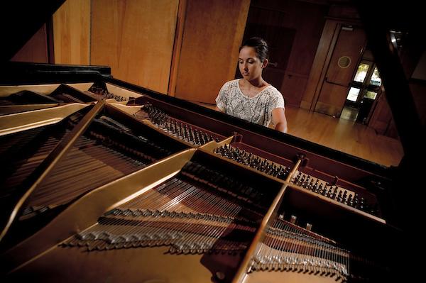 Female student playing the piano