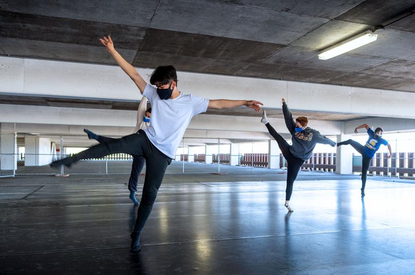 菠菜网lol正规平台 dancers mid-dance in the parking garage.